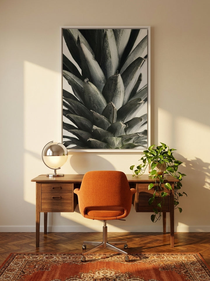 Canvas wall art with a white surround styled on the wall in a retro 70s home office