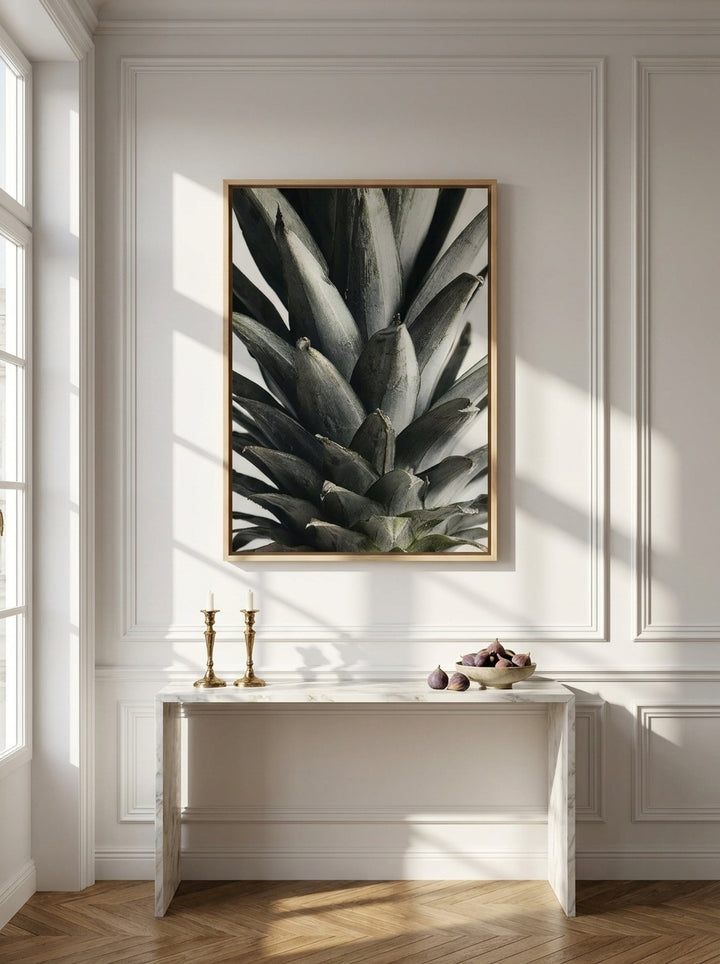 Oversized statement canvas wall art with a natural timber surround styled on the wall in a Parisian living room