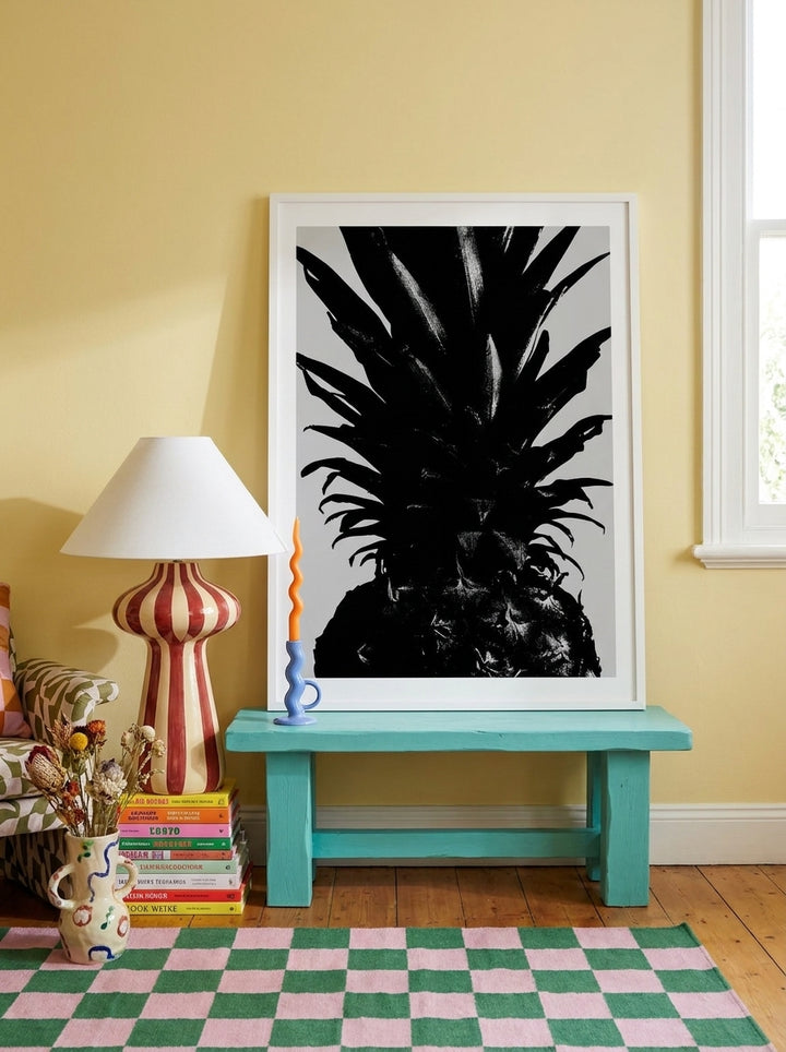 Modern wall art print standing on a side table in a colourful eclectic living room