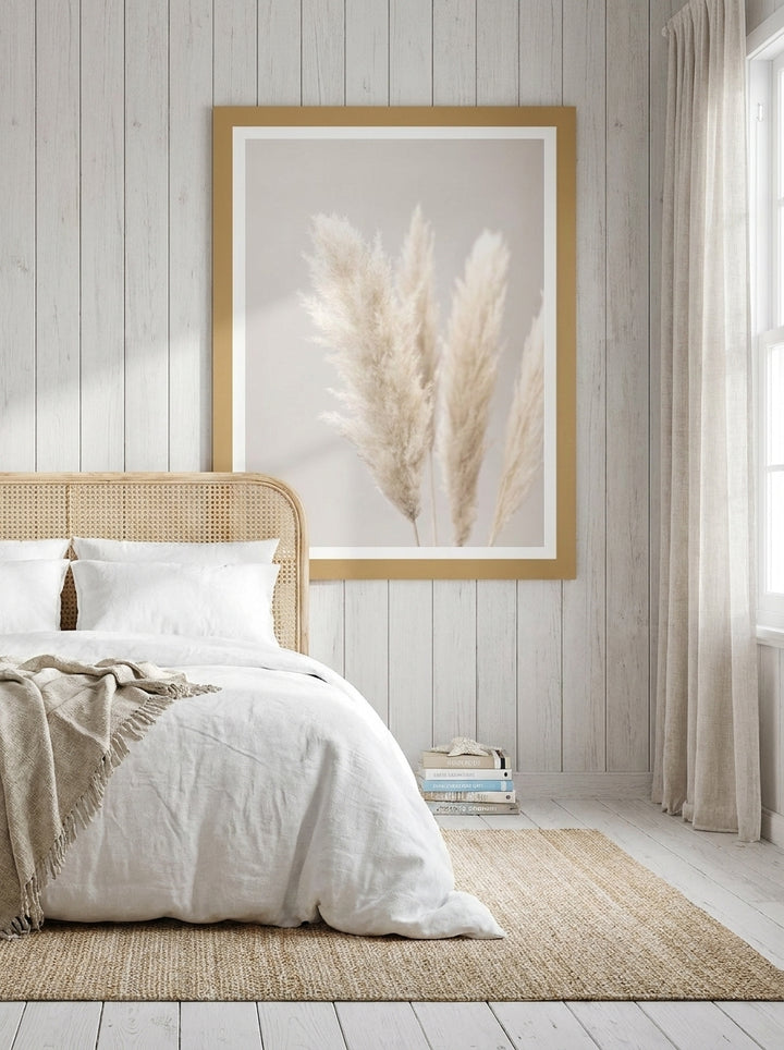Modern wall art print styled on the wall in a coastal bedroom