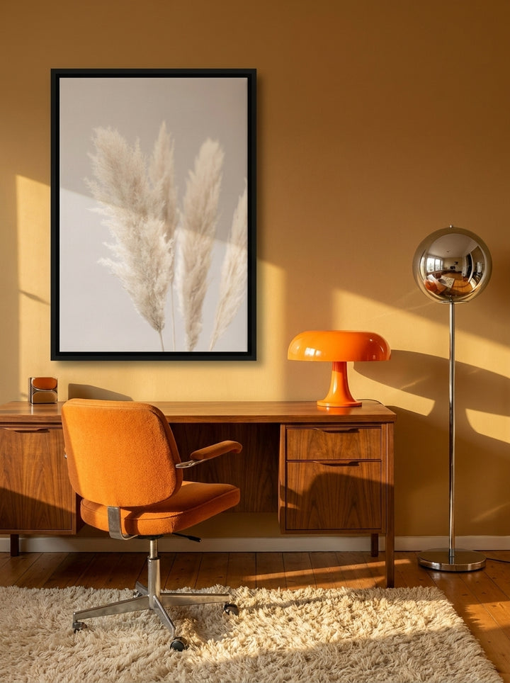 Canvas wall art with a black surround styled on the wall in a retro 70s home office