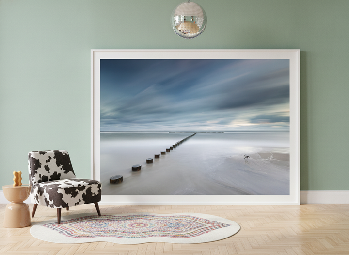 Oversized statement modern wall art print leaning against the wall in a colourful eclectic living room