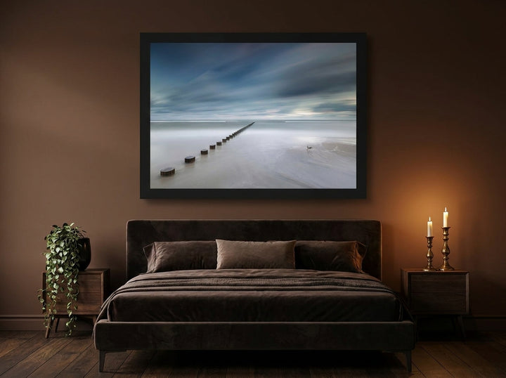 Modern wall art print styled on the wall in a moody bedroom