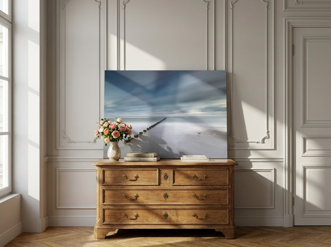Stretched canvas wall art standing on a sideboard in a Parisian bathroom