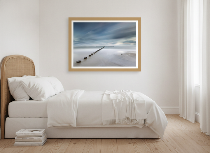 Modern wall art print styled on the wall in a coastal bedroom