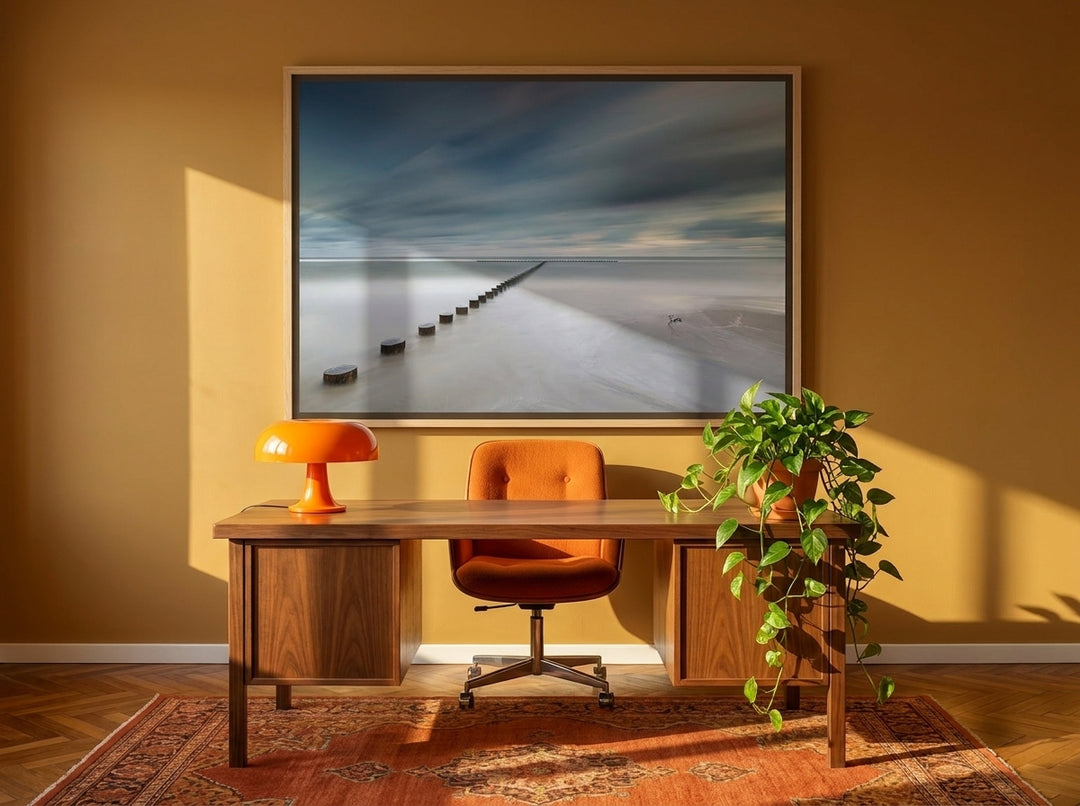 Oversized statement canvas wall art with a natural timber surround styled on the wall in a retro 70s home office