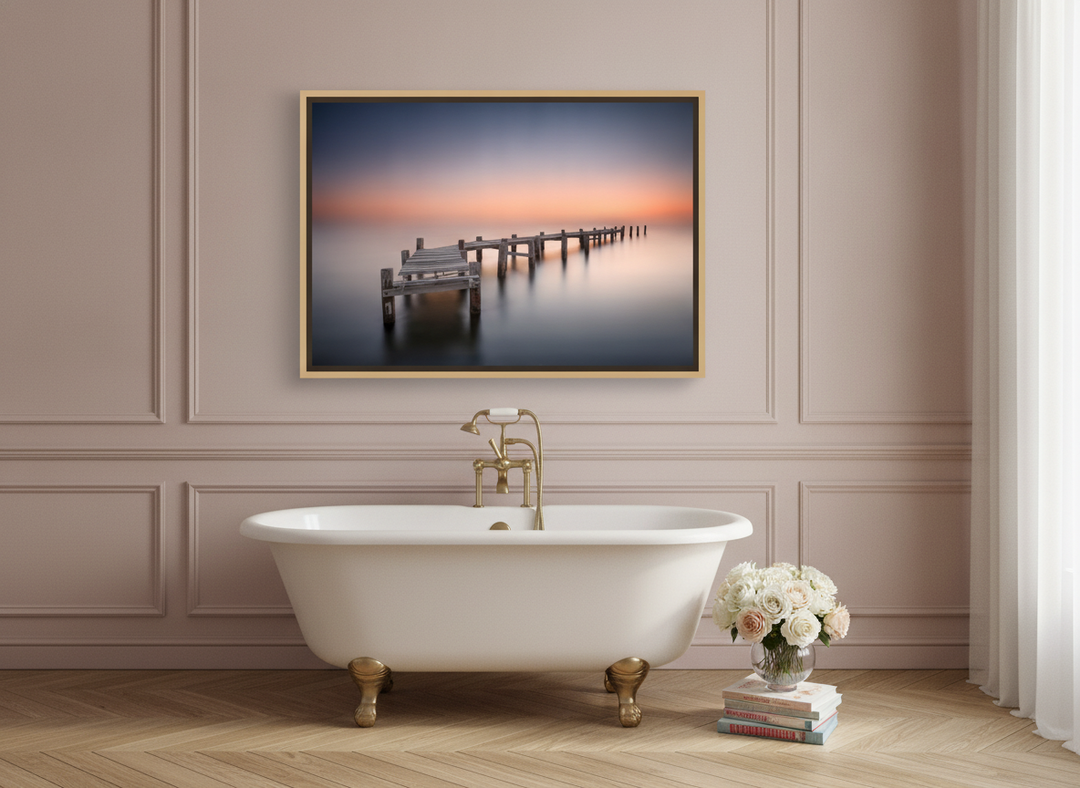 Canvas wall art with a natural timber surround styled on the wall in a Parisian bathroom