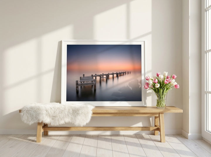 Modern wall art print standing on a bench in a bright Scandinavian bathroom