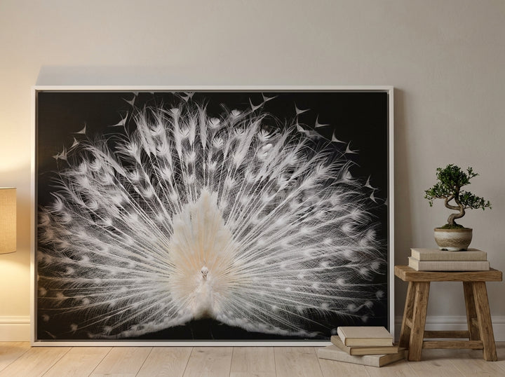 Oversized statement canvas wall art with a white surround leaning against the wall in a warm Japandi dining room