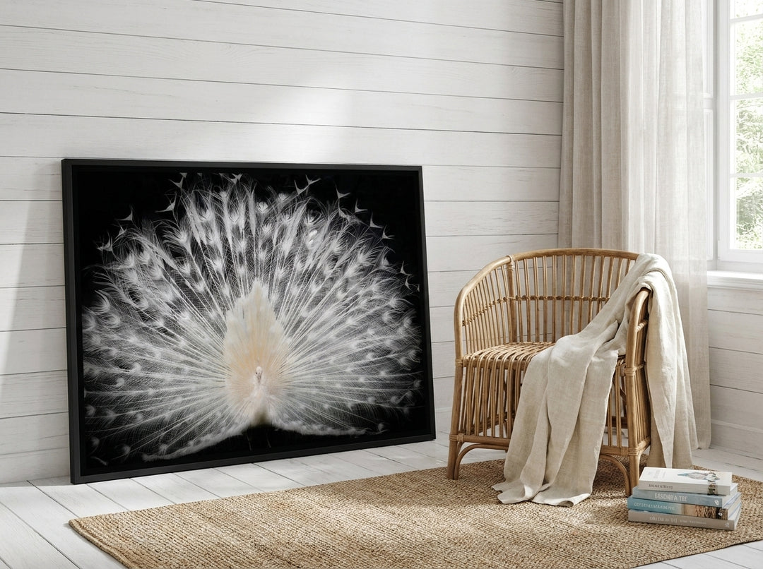 Canvas wall art with a black surround leaning against the wall in a coastal home office