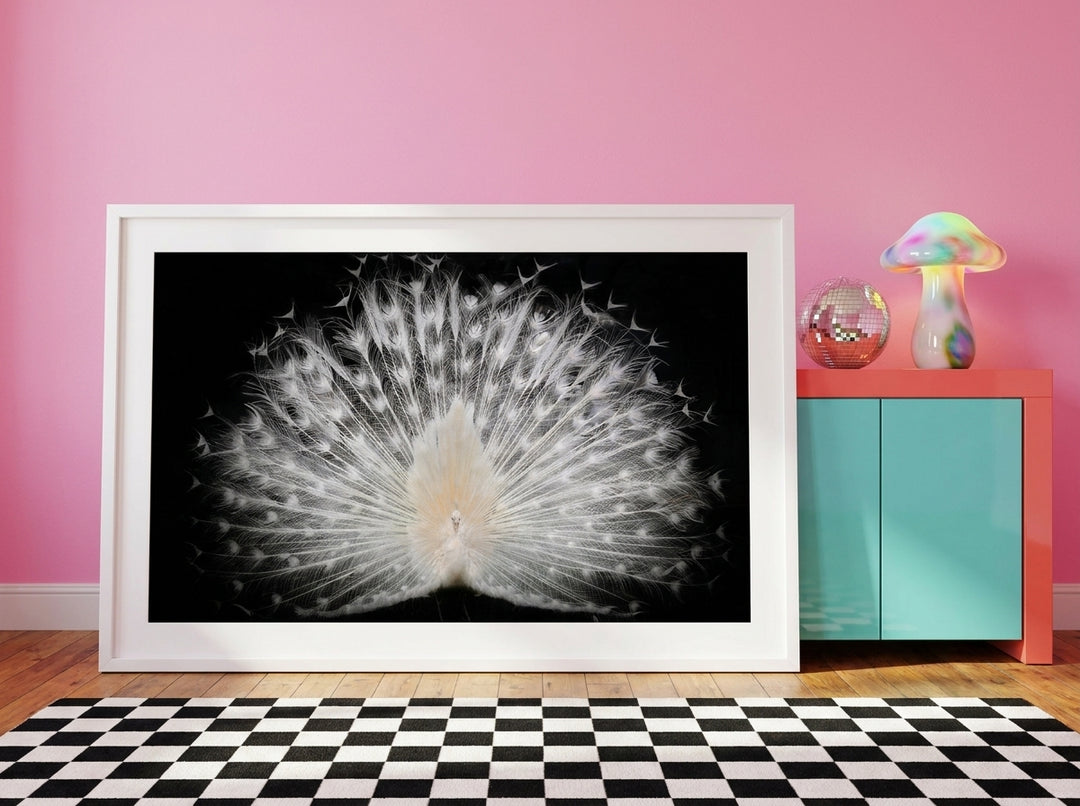 Modern wall art print standing on a sideboard in a colourful eclectic living room