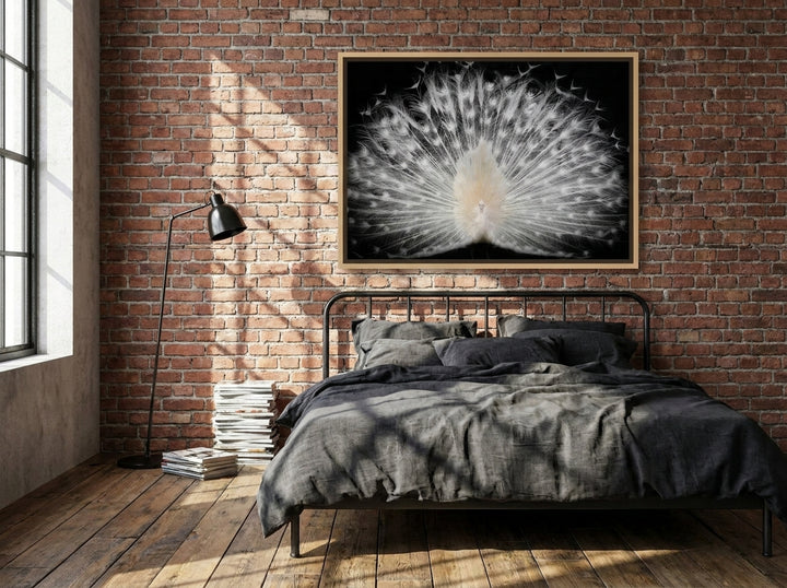 Canvas wall art with a natural timber surround styled on the wall in an industrial loft bedroom