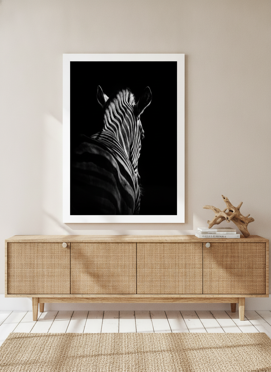 Modern wall art print standing on a sideboard in a coastal home office