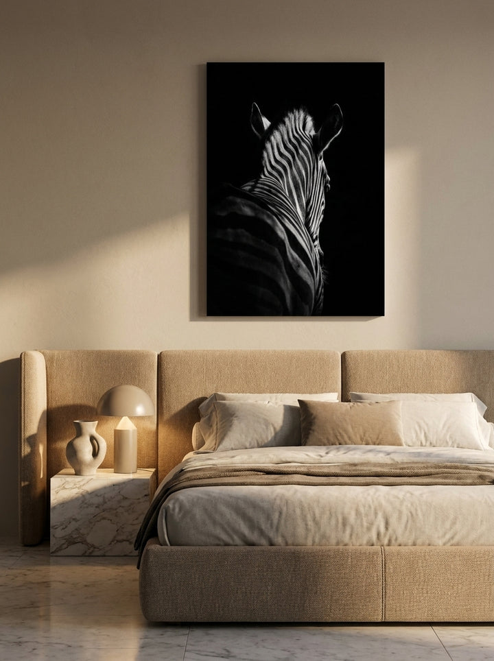 Stretched canvas wall art styled on the wall in a luxe bedroom