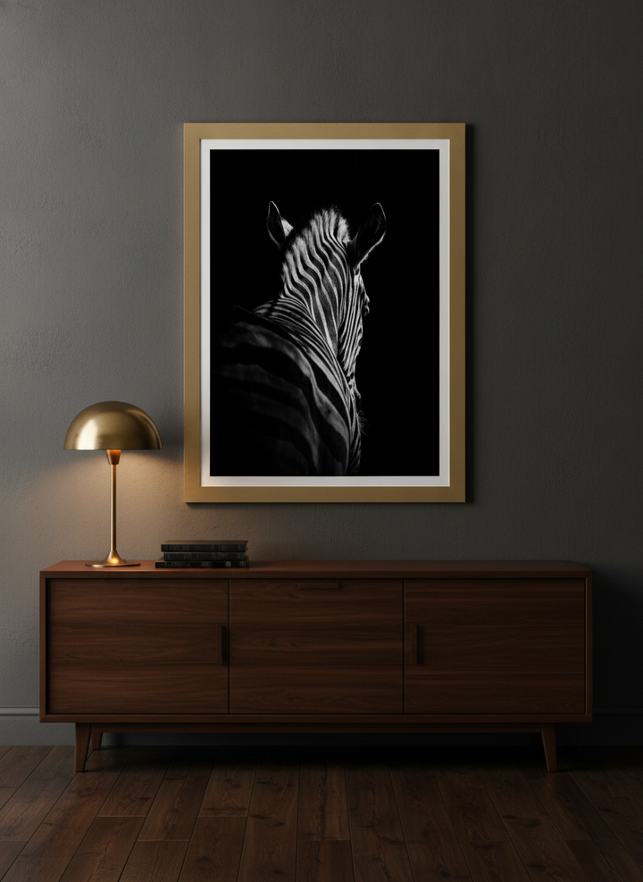 Modern wall art print styled on the wall in a moody living room