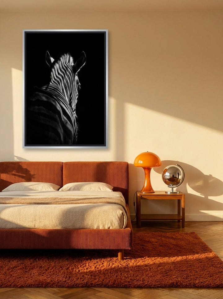 Canvas wall art with a silver leaf surround styled on the wall in a retro 70s bedroom