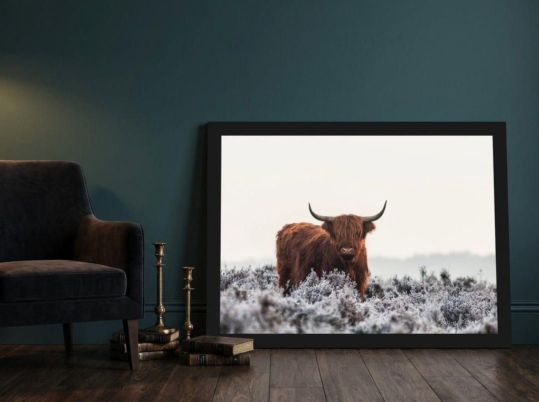 Modern wall art print leaning against the wall in a moody living room