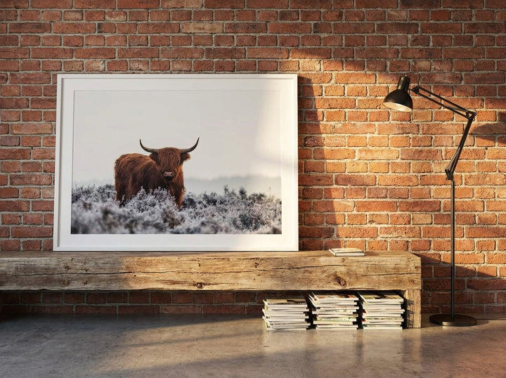 Modern wall art print standing on a bench in an industrial loft home office