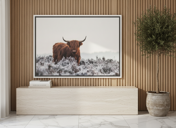 Canvas wall art with a white surround standing on a console in a luxe bedroom
