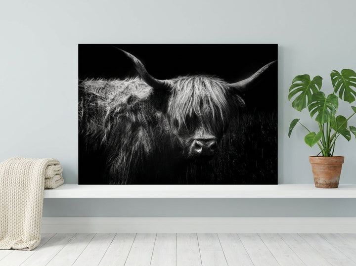 Stretched canvas wall art standing on a shelf in a bright Scandinavian living room