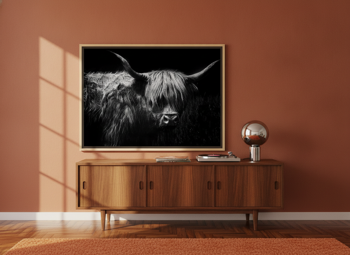 Canvas wall art with a natural timber surround standing on a sideboard in a retro 70s home office