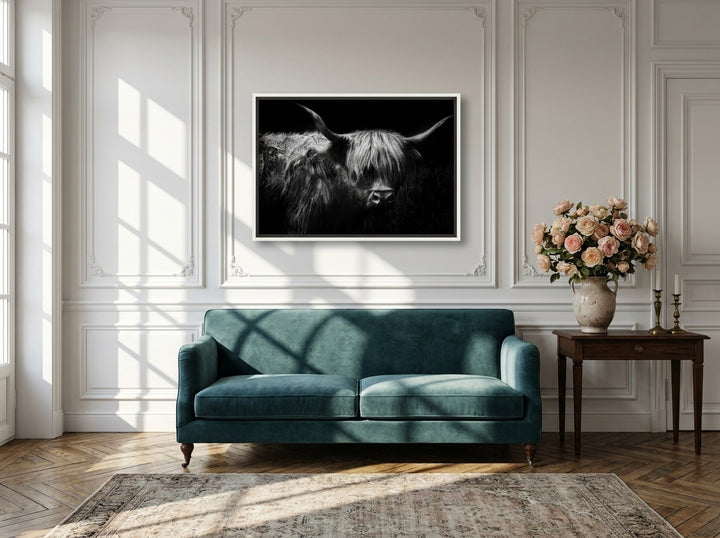 Canvas wall art with a white surround styled on the wall in a Parisian living room
