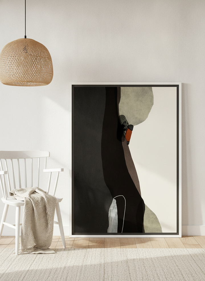 Canvas wall art with a white surround leaning against the wall in a bright Scandinavian home office
