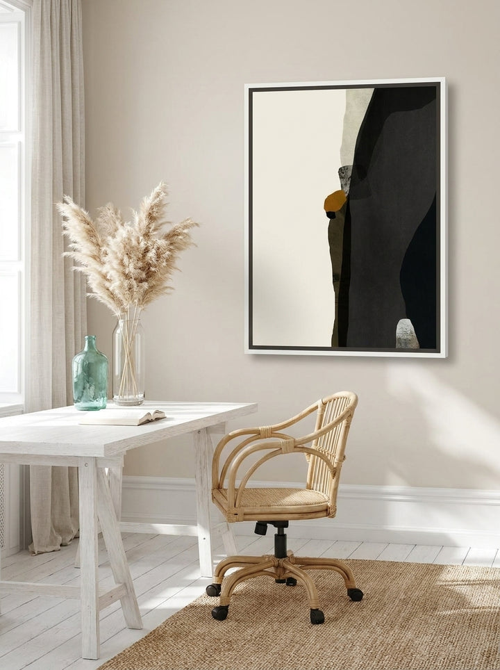 Canvas wall art with a white surround styled on the wall in a coastal home office