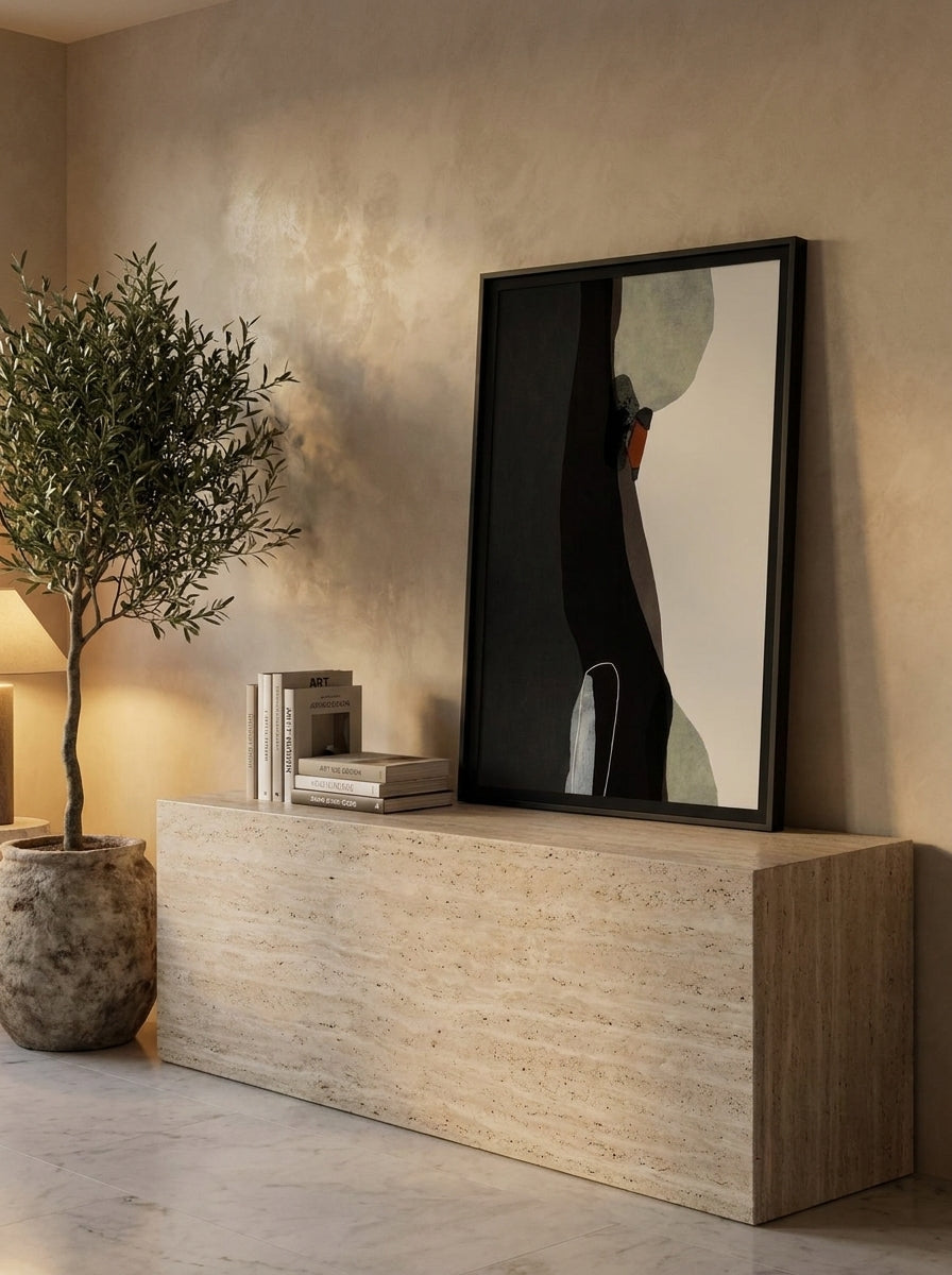 Modern wall art print standing on a console in a luxe home office