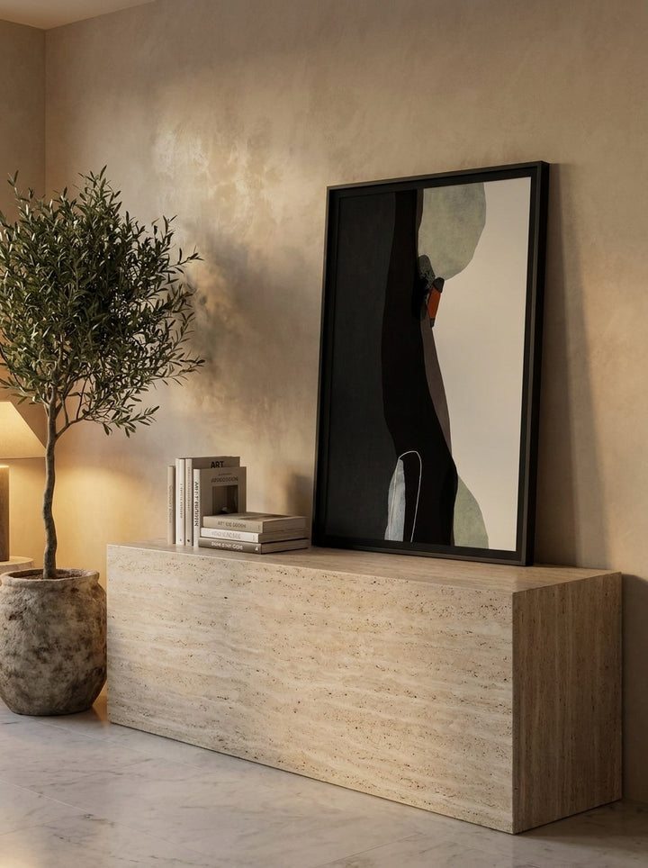 Modern wall art print standing on a console in a luxe home office