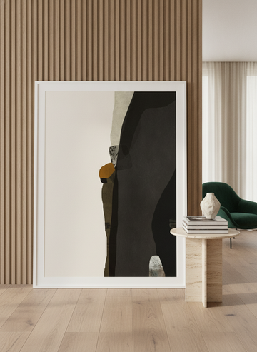 Oversized statement modern wall art print leaning against the wall in a luxe living room