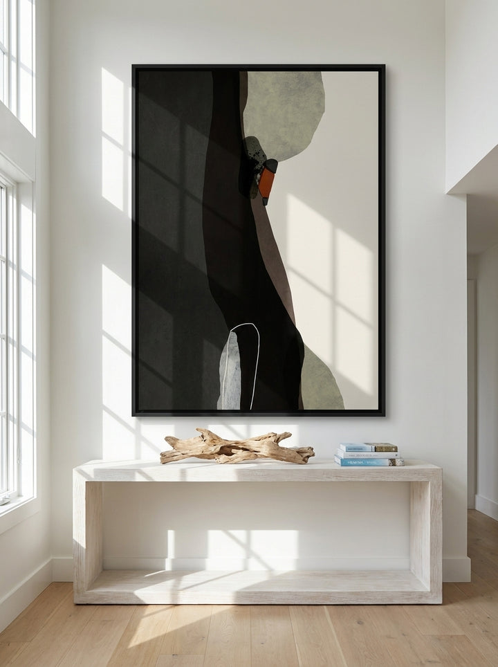 Oversized statement canvas wall art with a black surround styled on the wall in a coastal living room