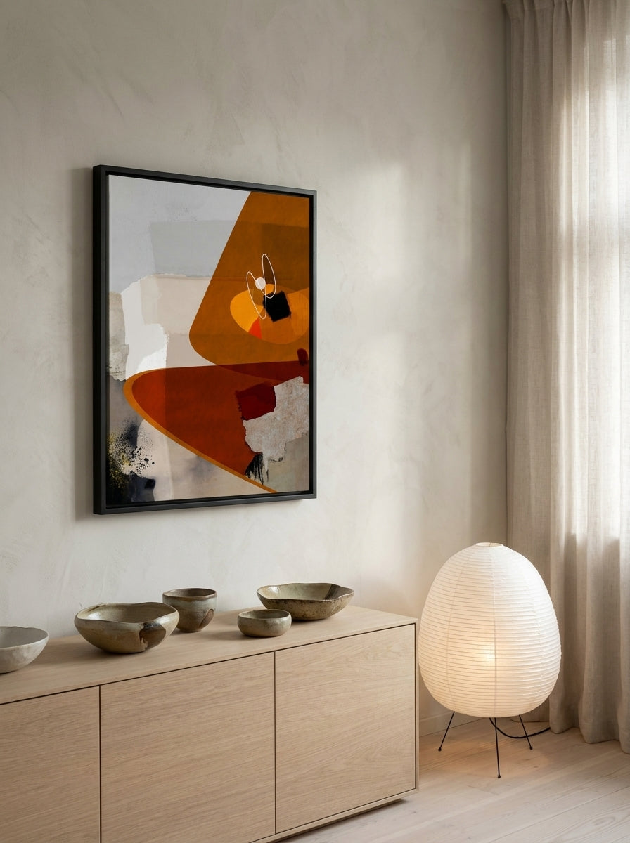 Canvas wall art with a black surround styled on the wall in a warm Japandi living room