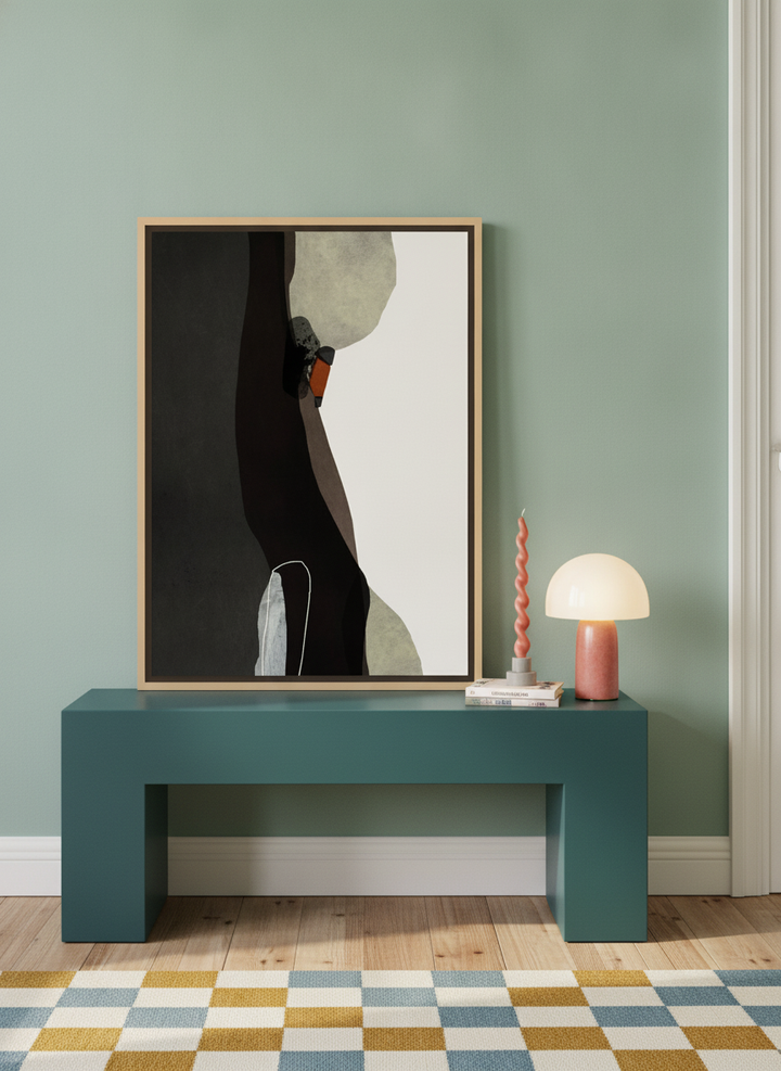 Canvas wall art with a natural timber surround standing on a side table in a colourful eclectic bedroom