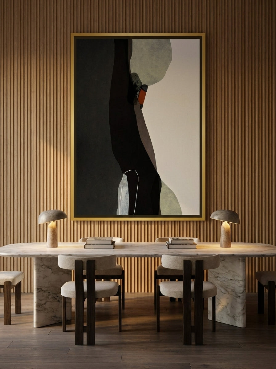 Oversized statement canvas wall art with a gold leaf surround styled on the wall in a luxe dining room