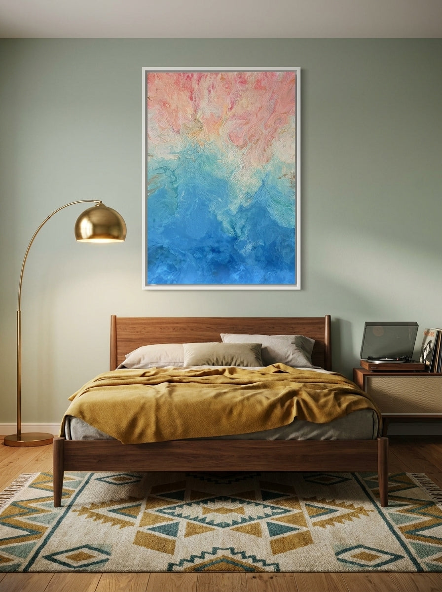 Canvas wall art with a white surround styled on the wall in a mid-century bedroom