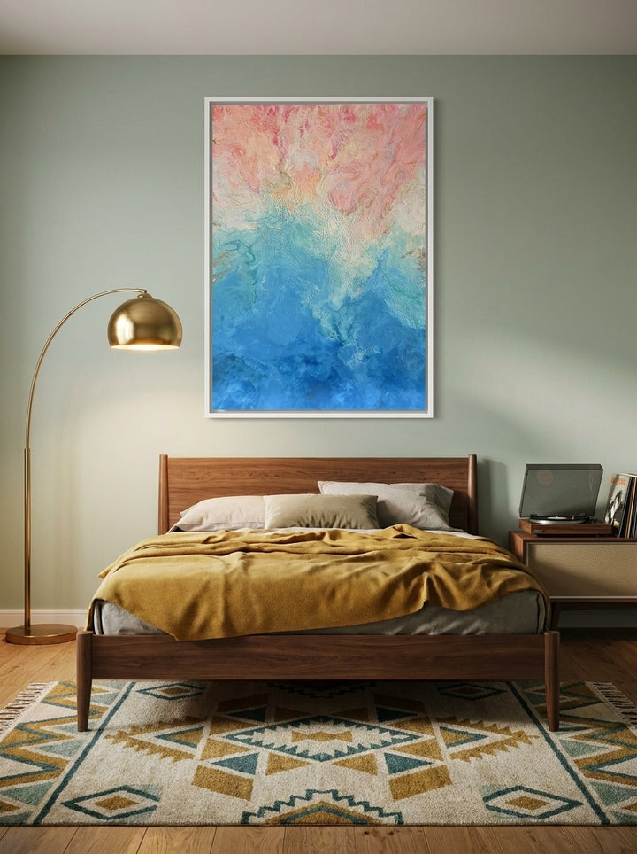 Canvas wall art with a white surround styled on the wall in a mid-century bedroom