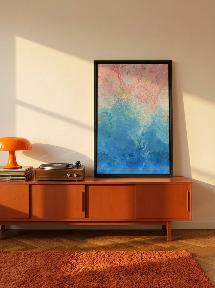 Canvas wall art with a black surround standing on a sideboard in a retro 70s living room