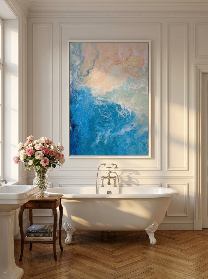 Canvas wall art with a white surround styled on the wall in a Parisian bathroom