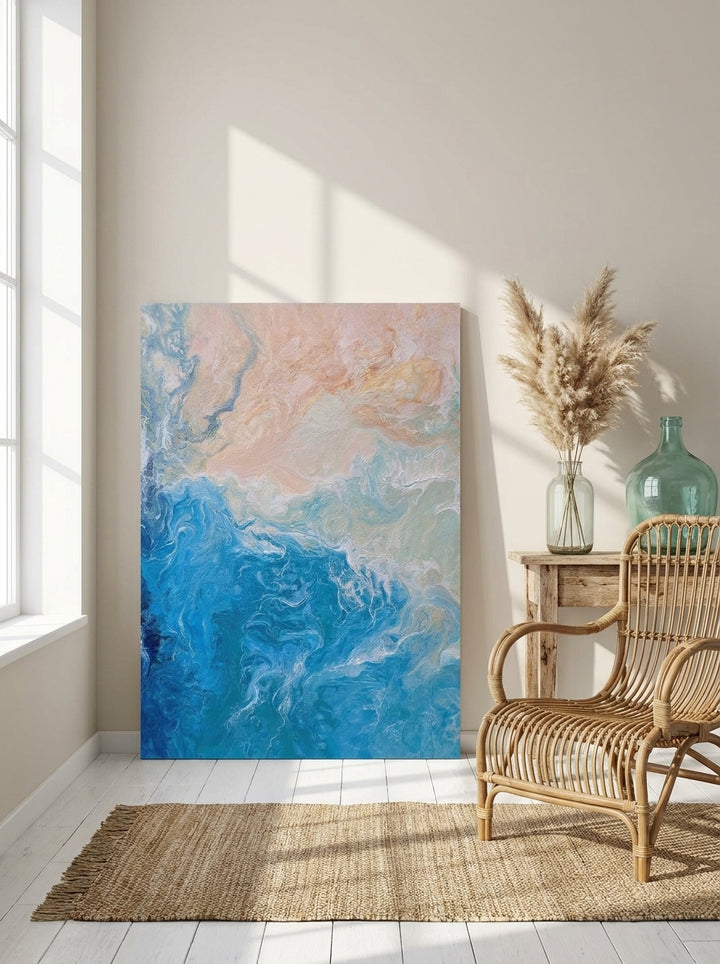 Stretched canvas wall art leaning against the wall in a coastal bedroom