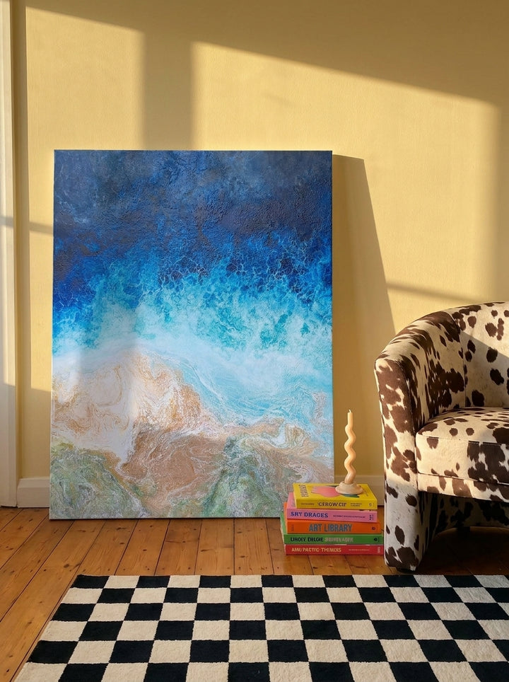 Stretched canvas wall art leaning against the wall in a colourful eclectic living room