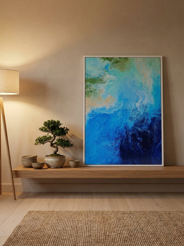 Modern wall art print standing on a shelf in a warm Japandi bedroom
