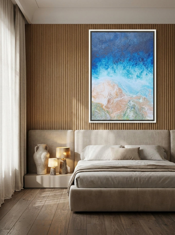 Oversized statement canvas wall art with a white surround styled on the wall in a luxe bedroom