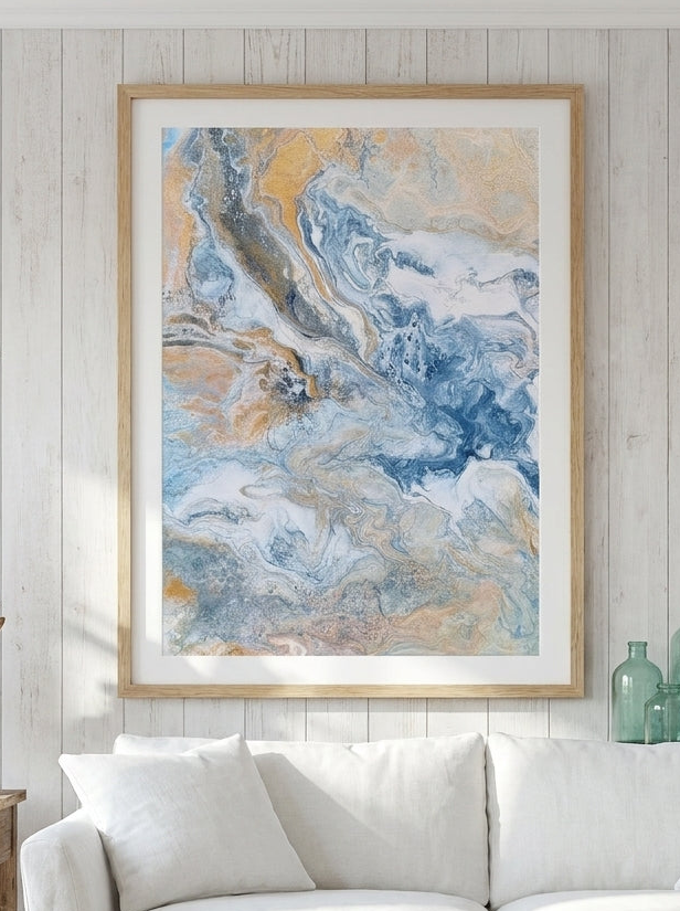 Modern wall art print styled on the wall in a coastal living room