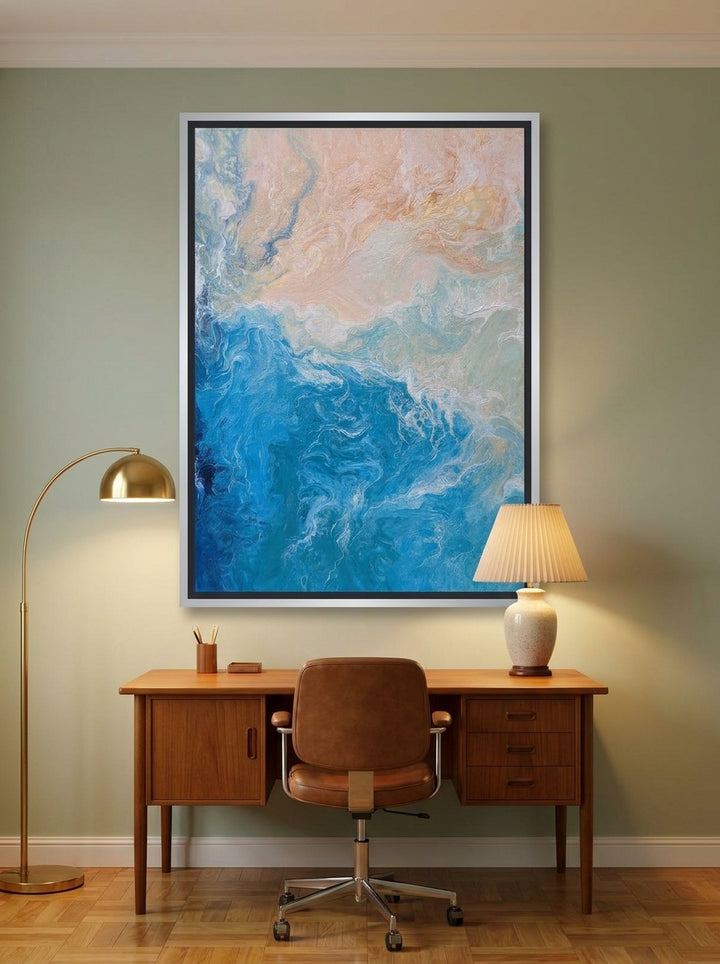 Canvas wall art with a silver leaf surround styled on the wall in a mid-century home office