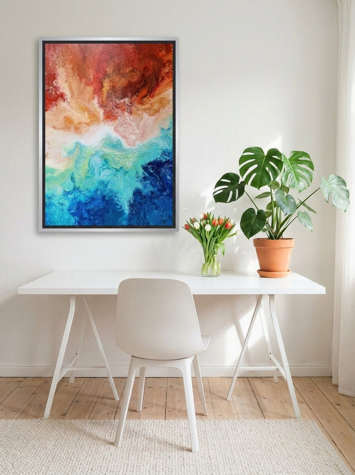 Canvas wall art with a silver leaf surround styled on the wall in a bright Scandinavian home office