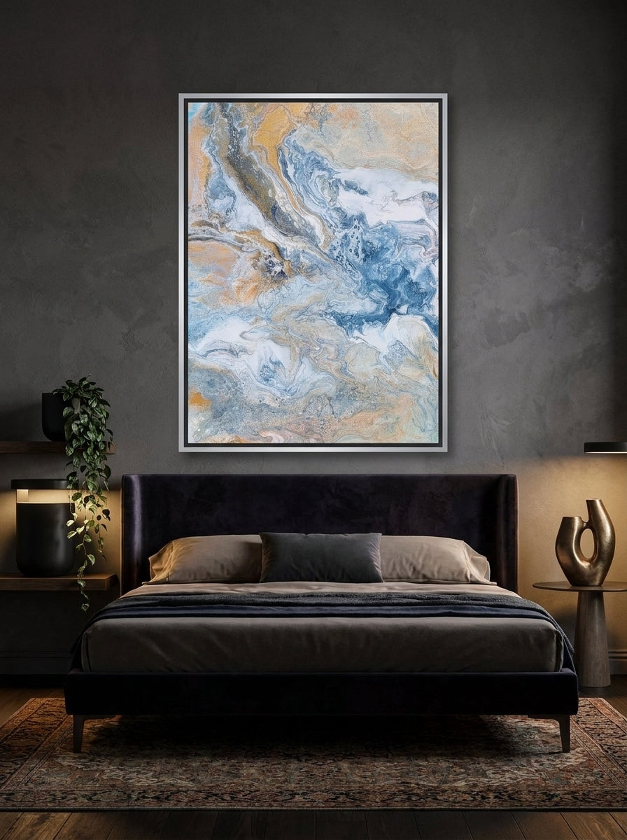 Canvas wall art with a silver leaf surround styled on the wall in a moody bedroom