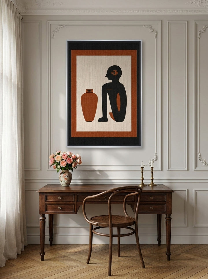 Canvas wall art with a silver leaf surround styled on the wall in a Parisian home office