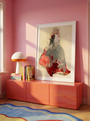 Modern wall art print standing on a sideboard in a colourful eclectic bedroom