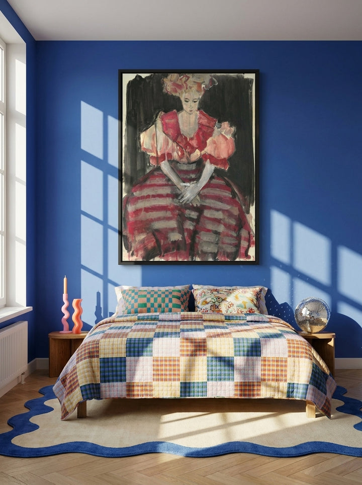Canvas wall art with a black surround styled on the wall in a colourful eclectic bedroom